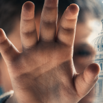 Child Abuse fake AI images - California Family Council Raised hand in the foreground blocks the view of the U.S. Capitol, with a digital circuit backdrop suggesting technology and control.